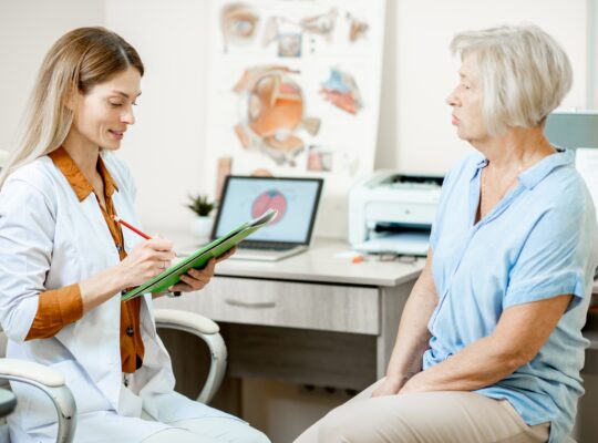 Senior patient with ophthalmologist in the office